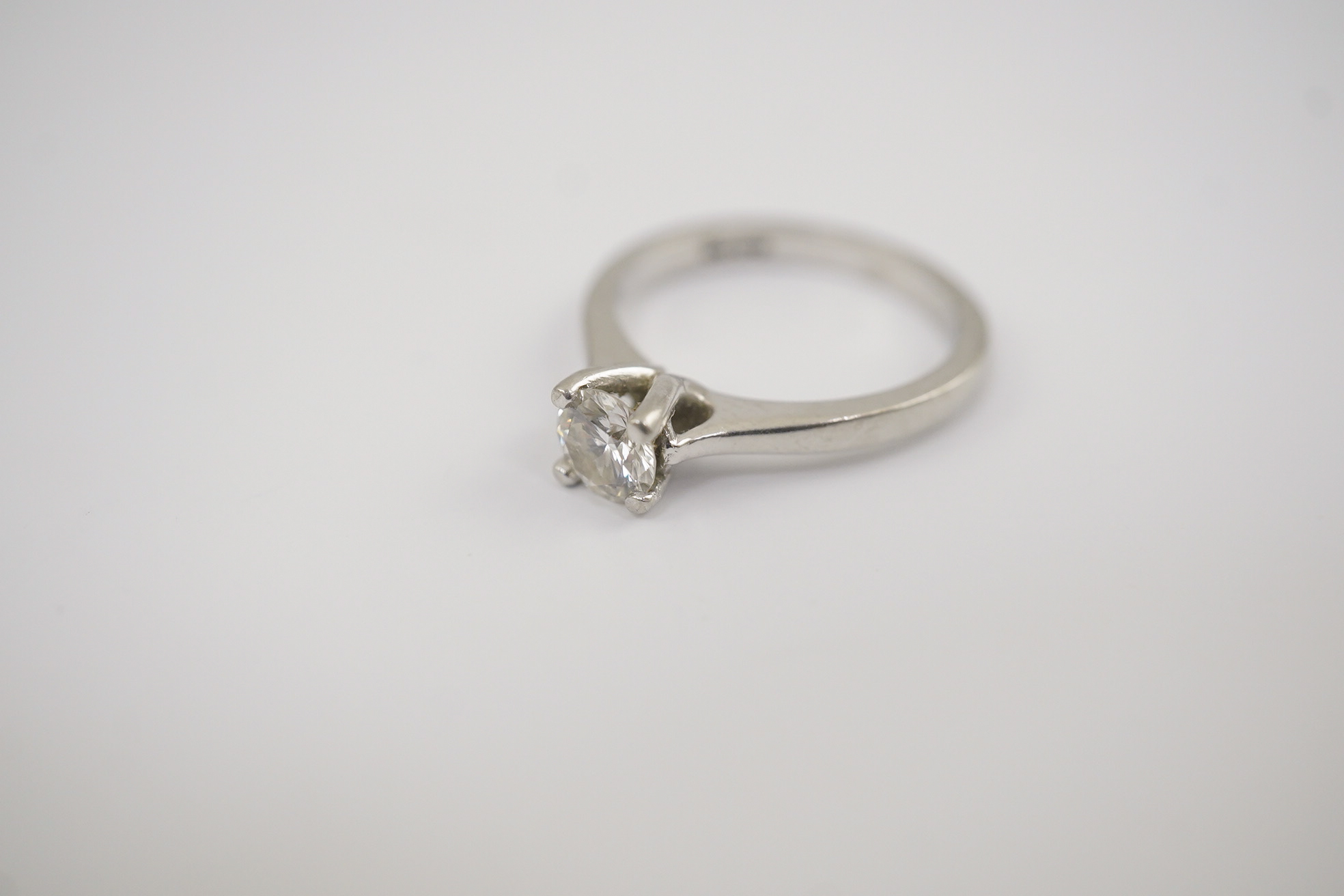 A modern platinum and solitaire diamond set ring